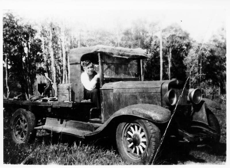 Fr Linanne, parish priest of Mundaring, at the wheel of his 1929 Chevrolet, c. 1953